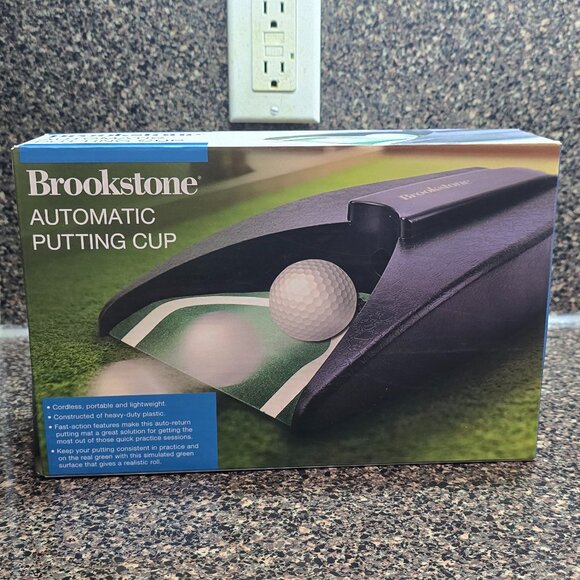 NIP / SEALED Brookstone Automatic Putting Cup Cordless Portable - Picture 1 of 4
